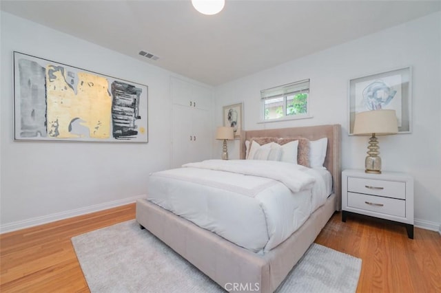 bedroom featuring hardwood / wood-style flooring