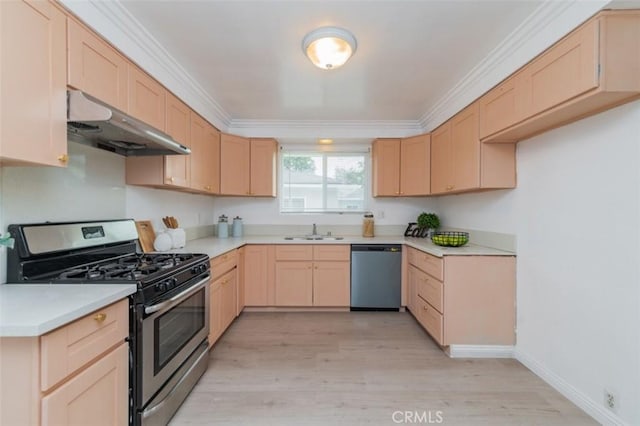 kitchen with stainless steel appliances, light brown cabinetry, light hardwood / wood-style floors, and sink