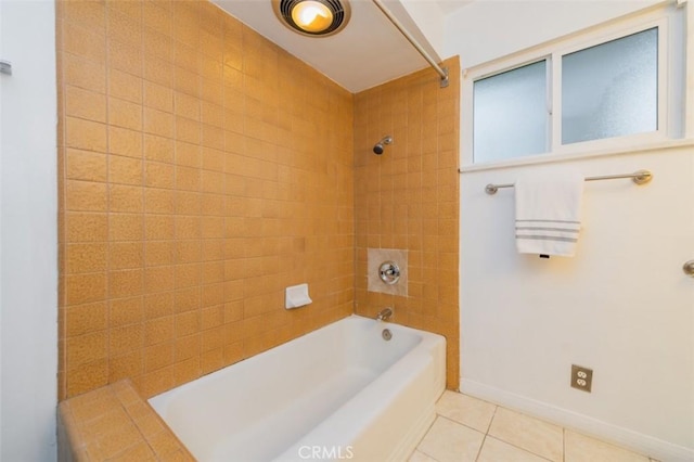 bathroom featuring tiled shower / bath combo and tile patterned flooring