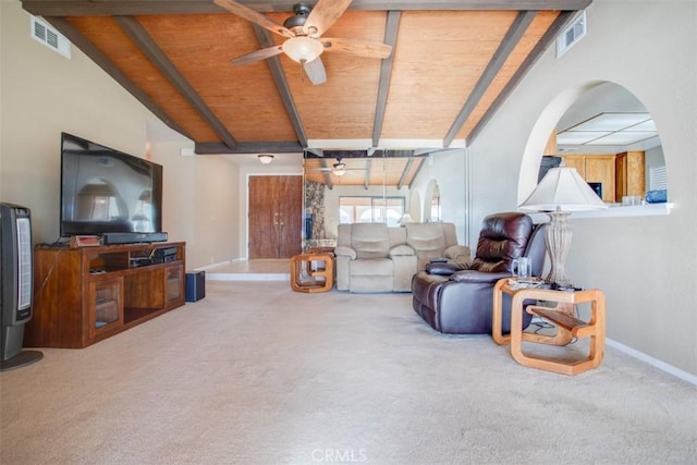 carpeted living room with ceiling fan, lofted ceiling with beams, and wood ceiling