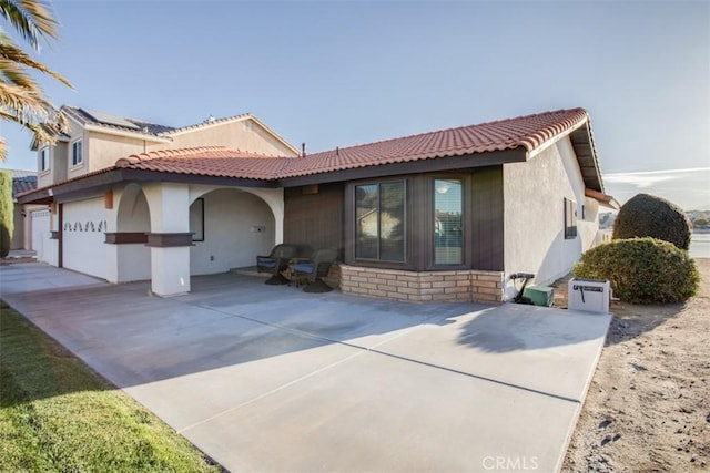 mediterranean / spanish house featuring a garage