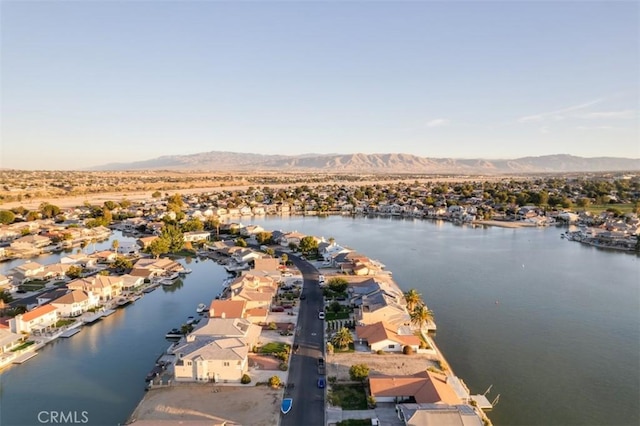 bird's eye view with a water and mountain view