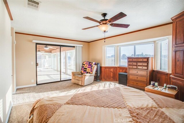 bedroom featuring access to outside, ceiling fan, light carpet, and ornamental molding