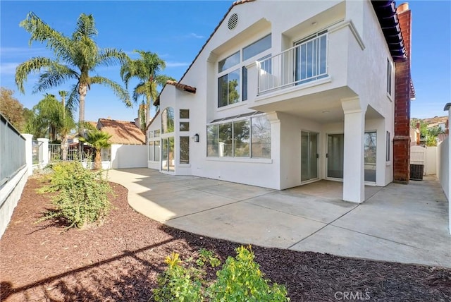 back of property featuring a patio