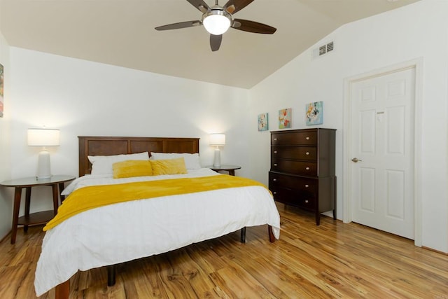 bedroom featuring vaulted ceiling, ceiling fan, and light hardwood / wood-style floors