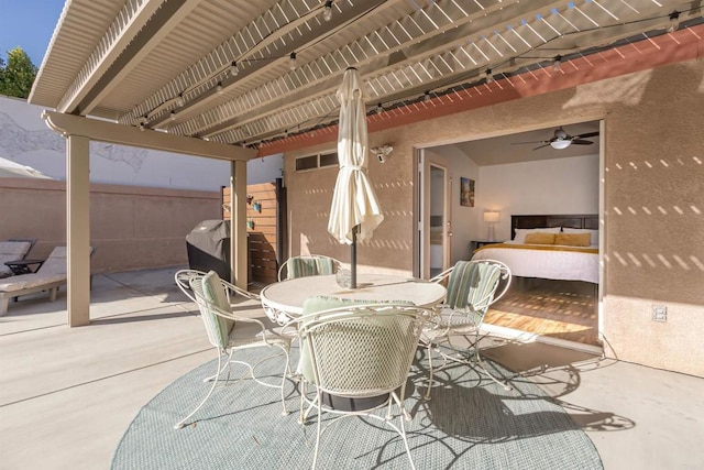 view of patio / terrace with a grill, ceiling fan, and a pergola