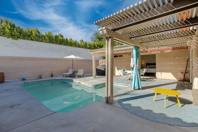 view of pool featuring a fenced in pool, a patio area, fence, and a pergola