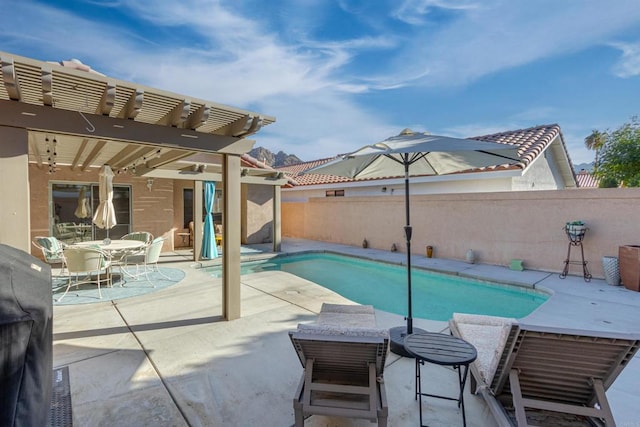 view of swimming pool featuring a fenced backyard, a fenced in pool, a pergola, and a patio