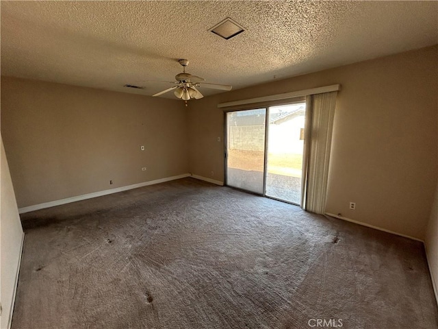 spare room featuring ceiling fan, a textured ceiling, and carpet