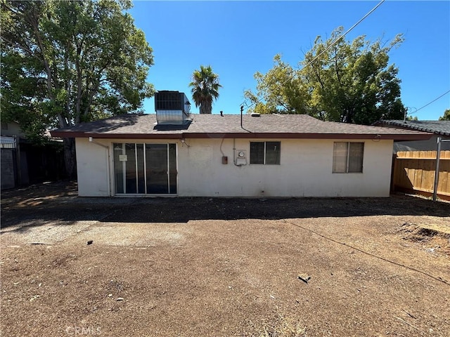 rear view of property with central air condition unit