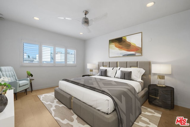 bedroom featuring ceiling fan and light hardwood / wood-style flooring