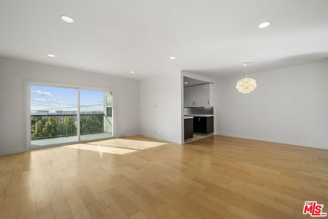 unfurnished living room with light hardwood / wood-style flooring