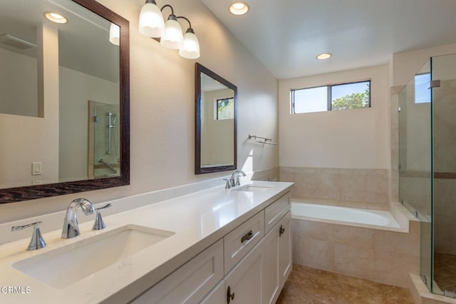 bathroom with separate shower and tub and vanity