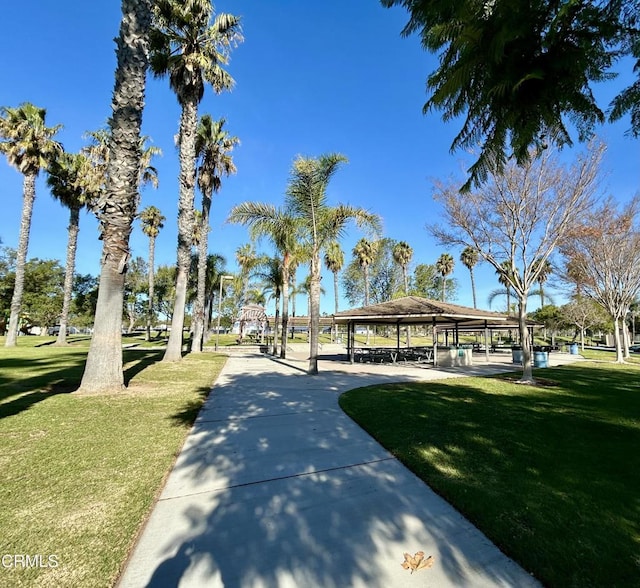 surrounding community with a gazebo and a yard