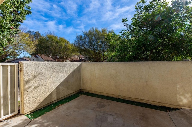 view of patio / terrace featuring fence