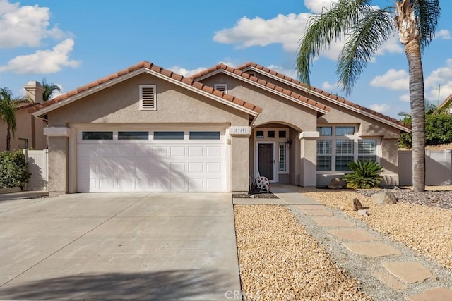 mediterranean / spanish-style home featuring a garage