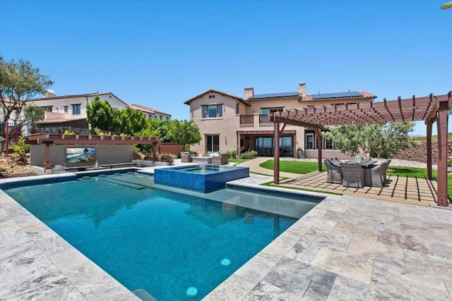 view of pool with a pergola, a patio area, and an in ground hot tub