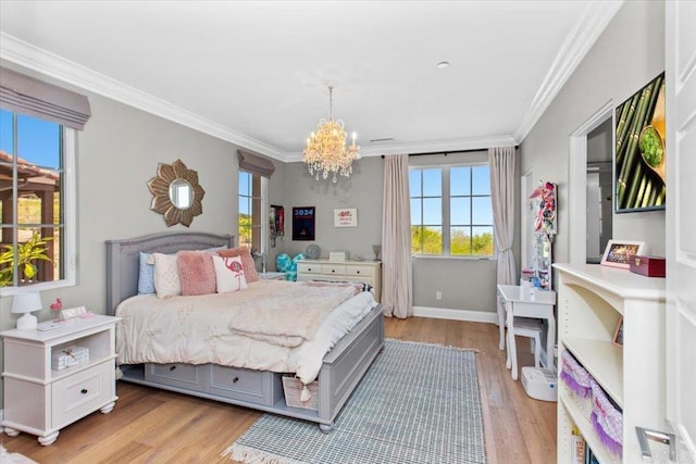 bedroom featuring light hardwood / wood-style floors, ornamental molding, and a chandelier