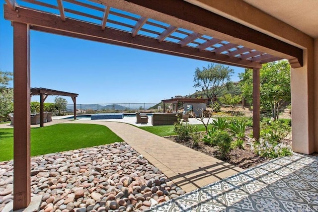 view of patio featuring a water view, a pergola, and an outdoor living space