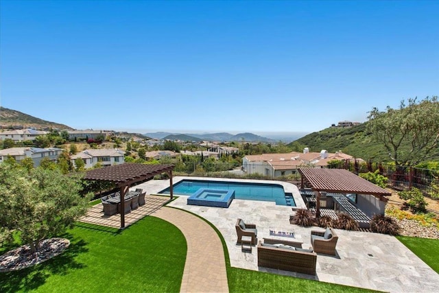 view of pool featuring a pergola, a mountain view, outdoor lounge area, and a yard