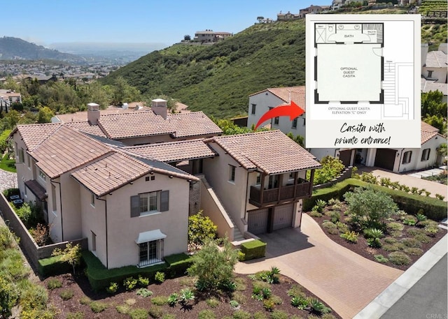 birds eye view of property featuring a mountain view