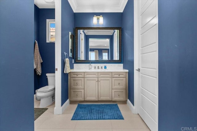 bathroom featuring toilet, tile patterned flooring, crown molding, and vanity