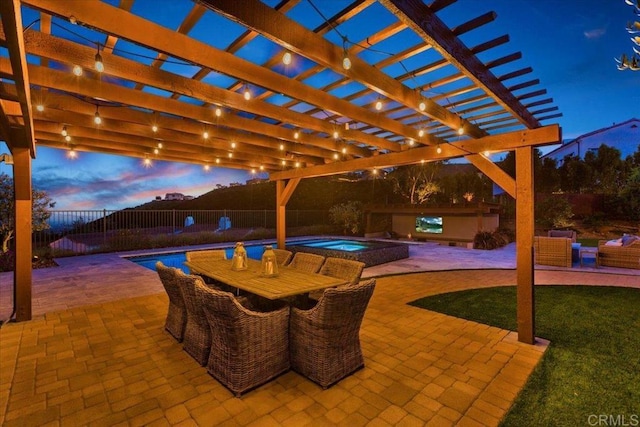 patio terrace at dusk with a pool with hot tub, an outdoor hangout area, and a pergola