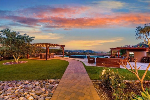 view of community featuring a lawn, a pergola, a patio area, and a pool