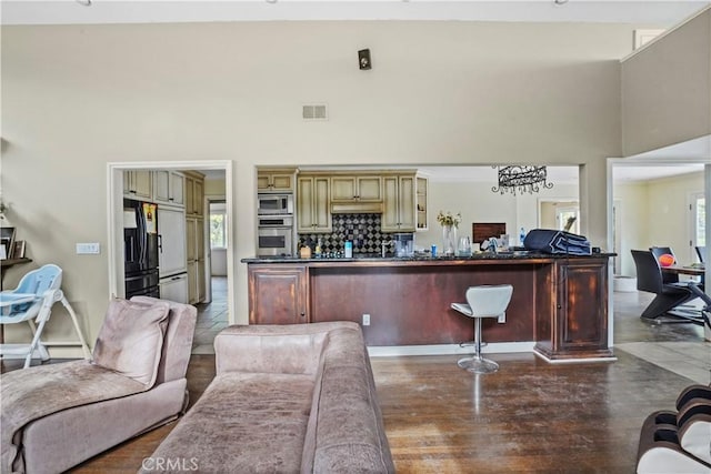 living room with a high ceiling