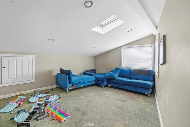 carpeted bedroom featuring vaulted ceiling with skylight