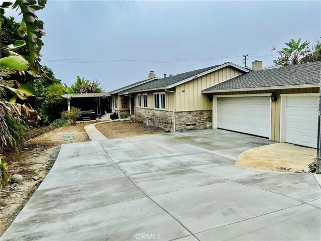 ranch-style house featuring a garage