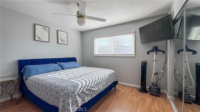 bedroom featuring ceiling fan and wood-type flooring