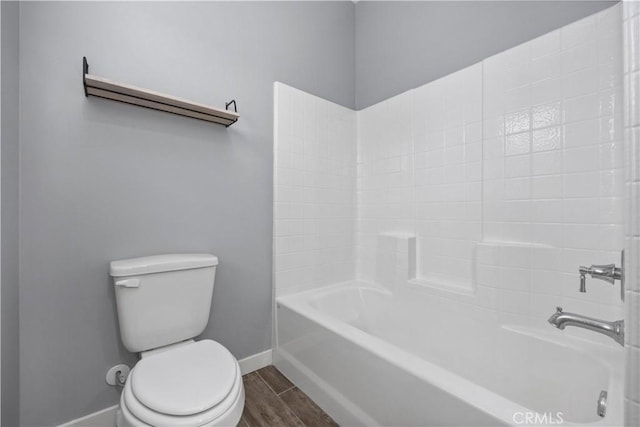 bathroom with toilet and bathtub / shower combination