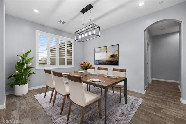 dining room featuring dark wood-type flooring