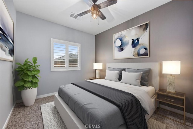 bedroom with ceiling fan and carpet floors