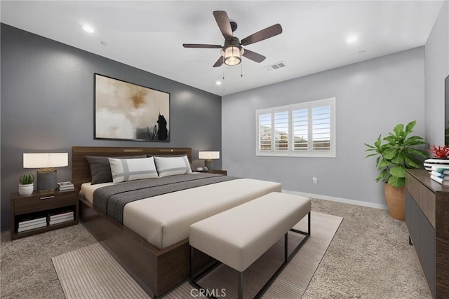 bedroom featuring ceiling fan and light colored carpet