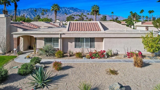 view of front of home with a mountain view