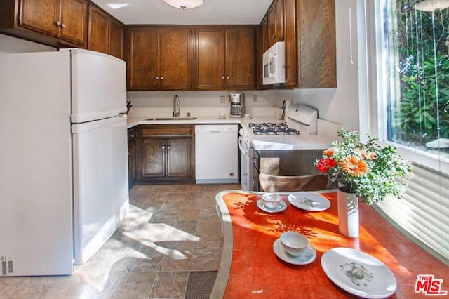 kitchen with sink and white appliances