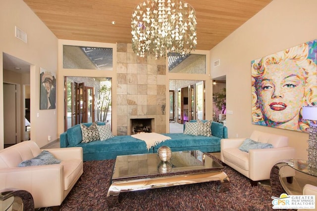 living room with a tiled fireplace, high vaulted ceiling, a notable chandelier, and wood ceiling