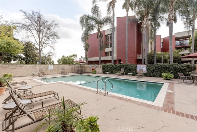 view of swimming pool featuring a patio