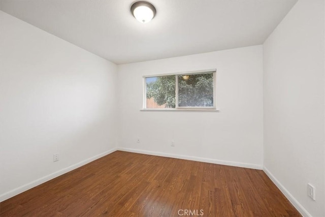 empty room featuring wood-type flooring