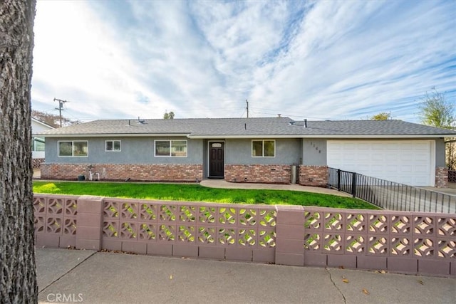 single story home with a garage and a front yard