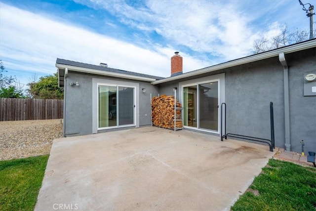 back of house featuring a patio area