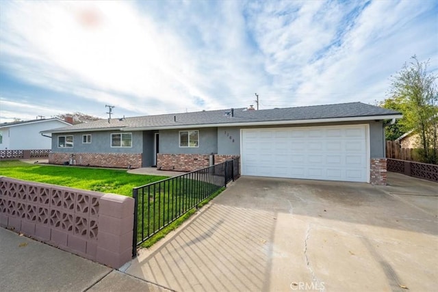 ranch-style home with a front lawn and a garage