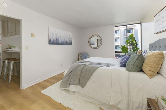 bedroom with light hardwood / wood-style floors