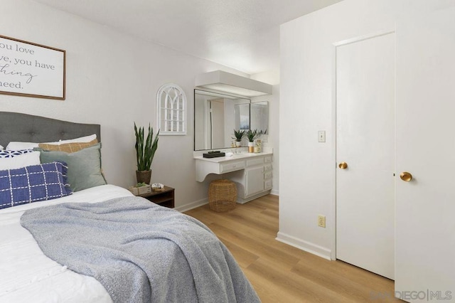 bedroom with light hardwood / wood-style flooring