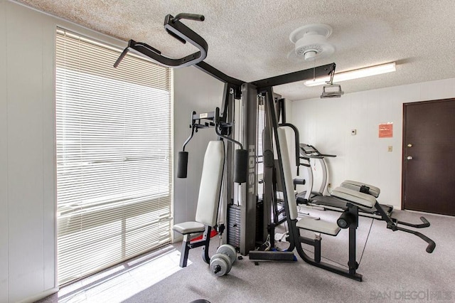 workout area with a textured ceiling