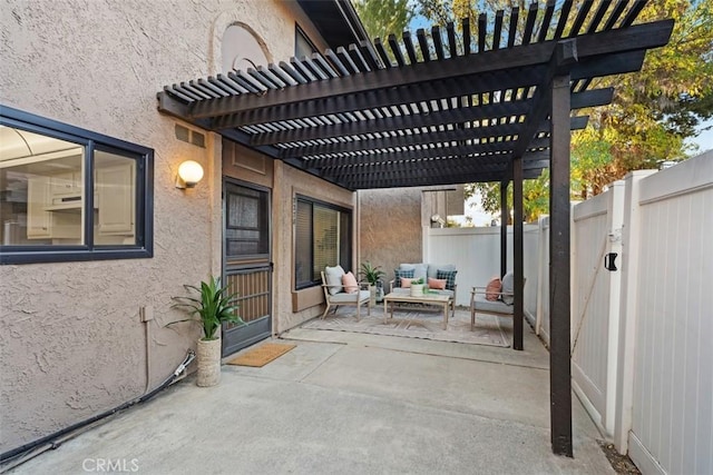 view of patio featuring an outdoor living space and a pergola