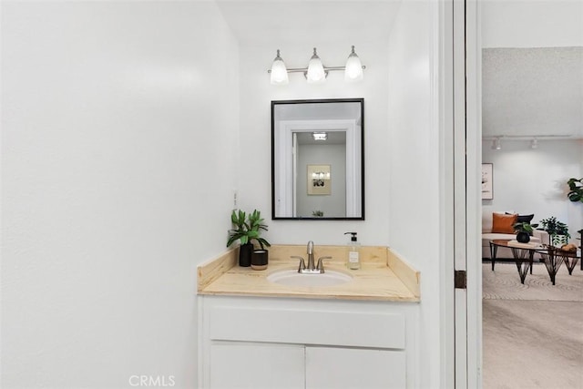 bathroom with vanity and rail lighting