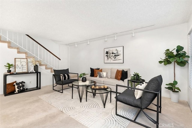 living room with light carpet and a textured ceiling